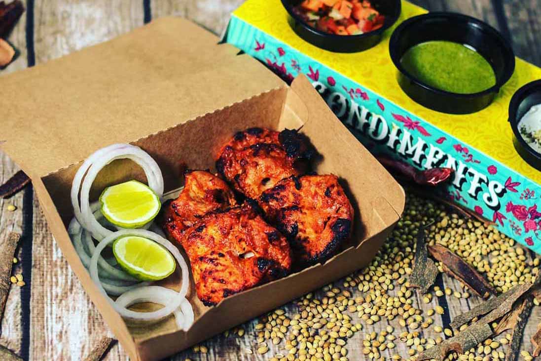 45278311_282751542381042_8919356059209715284_n copy Makhan Paaji packaging design held in hand — lifestyle photograph