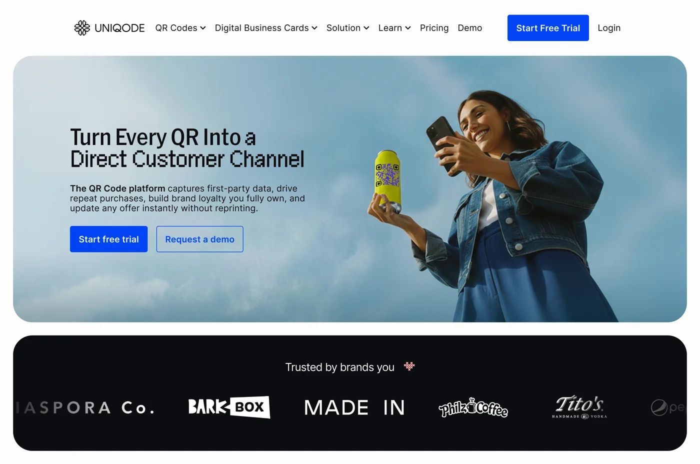 The new Uniqode CPG page: the same headline in a lighter pixel font, a lifestyle photo of a woman scanning a QR code on a yellow can, and a black trusted-by-brands bar.